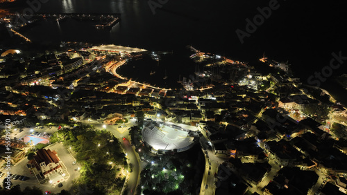 Aerial drone night shot of illuminated recently renovated round port of Mikrolimano in the heart of Piraeus, Attica, Greece photo