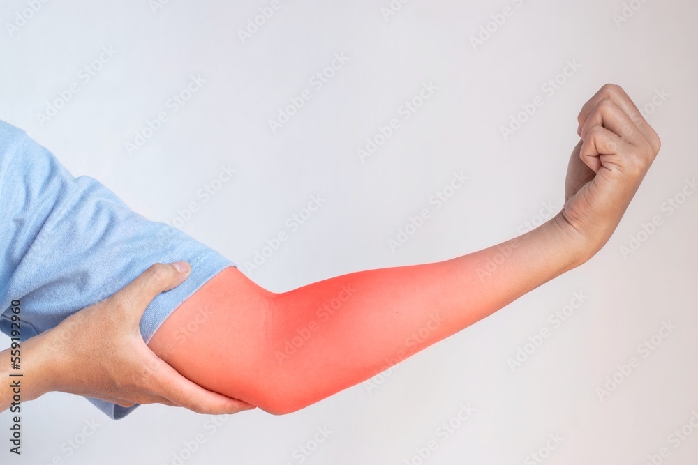 Pain in the upper arm of Southeast Asian young man. Concept of elbow and forearm pain, injury or muscle problem. Pain in the upper arm of Southeast Asian young man. Concept of elbow and forearm pain, injury or muscle problem.