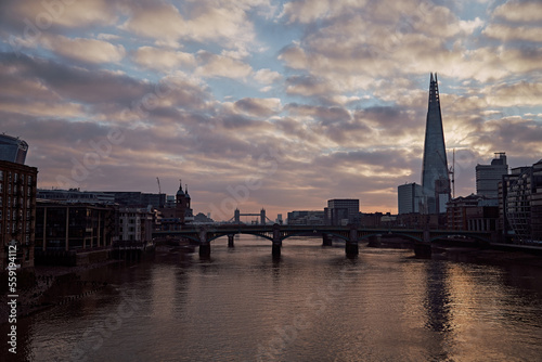 Looking down the River Thames towards Tower Bridge and The Shard at sunrise