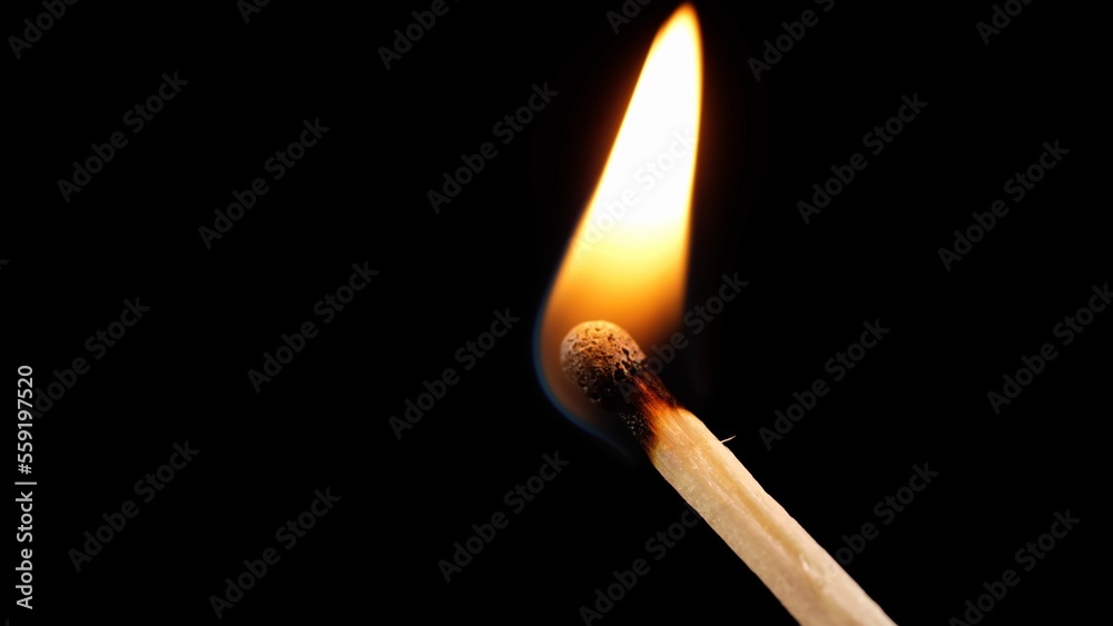 The match burns out on a dark background. Dark background wooden match close-up The match burns out on a dark background. Dark background wooden match close-up