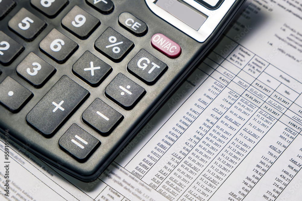 Utility bill and calculator on the table. Analysis of financial data. expenses are calculated.