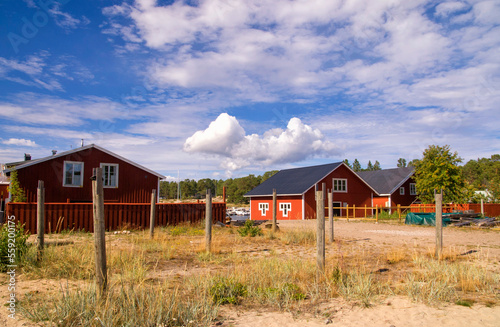 Red painted houses in the fishing village Holick