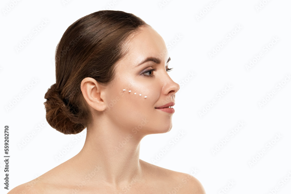 Close Up Of The Face Of A Beautiful Woman With Perfect Skin Thanks To Creams To Keep Young And Cream Contour Anti-Aging And Wrinkle Eyes. Concept Of Beauty, Cleanliness And Perfection. Close Up Of The Face Of A Beautiful Woman With Perfect Skin Thanks To Creams To Keep Young And Cream Contour Anti-Aging And Wrinkle Eyes. Concept Of Beauty, Cleanliness And Perfection.