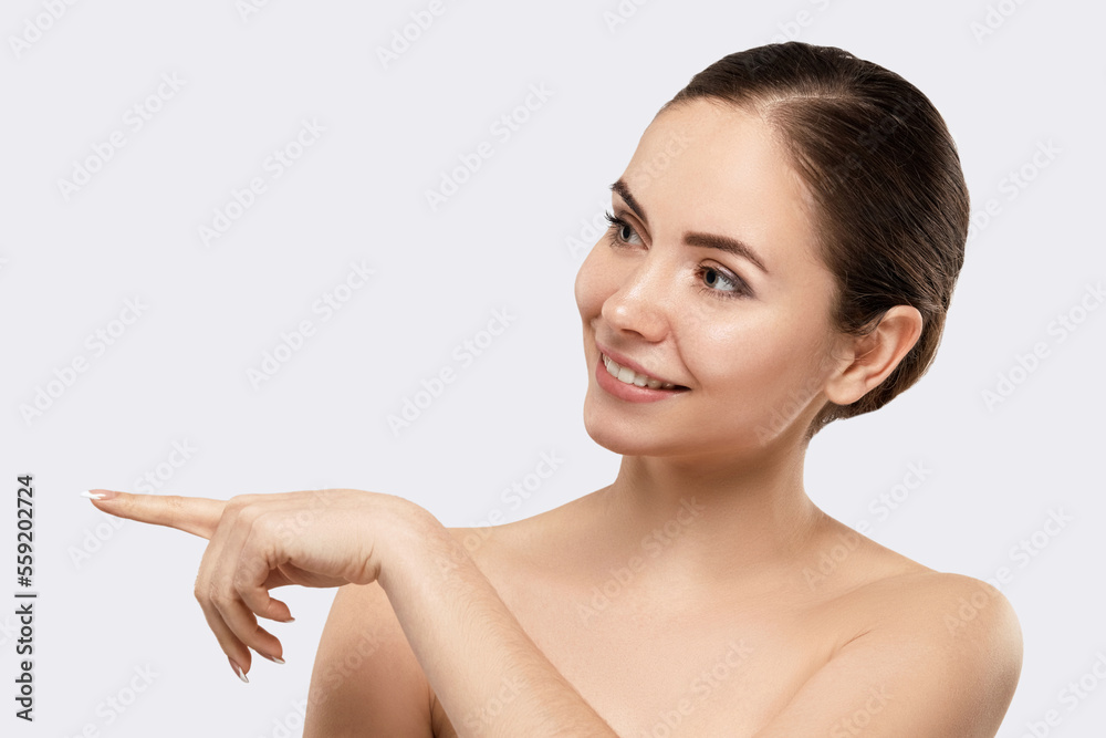 Beautiful Woman Surprised By Showing Product .Beautiful Girl With Pointing To The Side . Presenting Your Product. Isolated On White Background. Expressive Facial Expressions. Beautiful Woman Surprised By Showing Product .Beautiful Girl With Pointing To The Side . Presenting Your Product. Isolated On White Background. Expressive Facial Expressions.