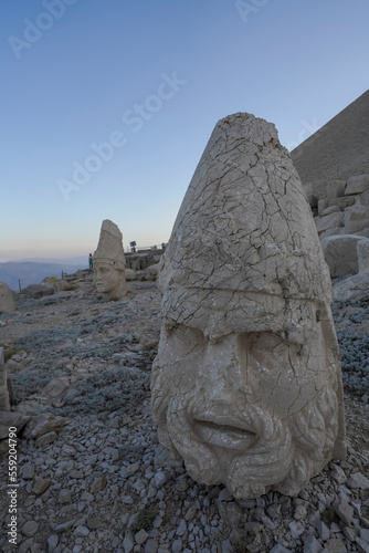 View of sculptures of mount nemrut, before sunrise monumental ruins with difused light and details photo