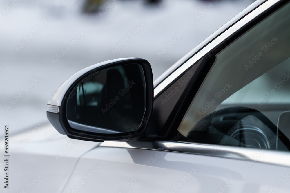 Rearview mirror of a modern white car. Rearview mirror of a modern white car.