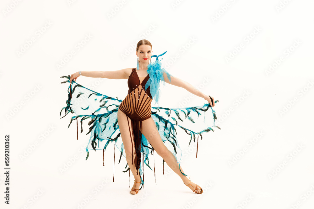 A dancer girl in a peacock-style costume
