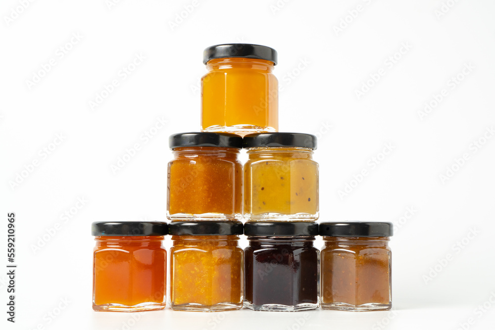 Pyramid of jams. Different jam jars in piramid. Jam set. Different jam