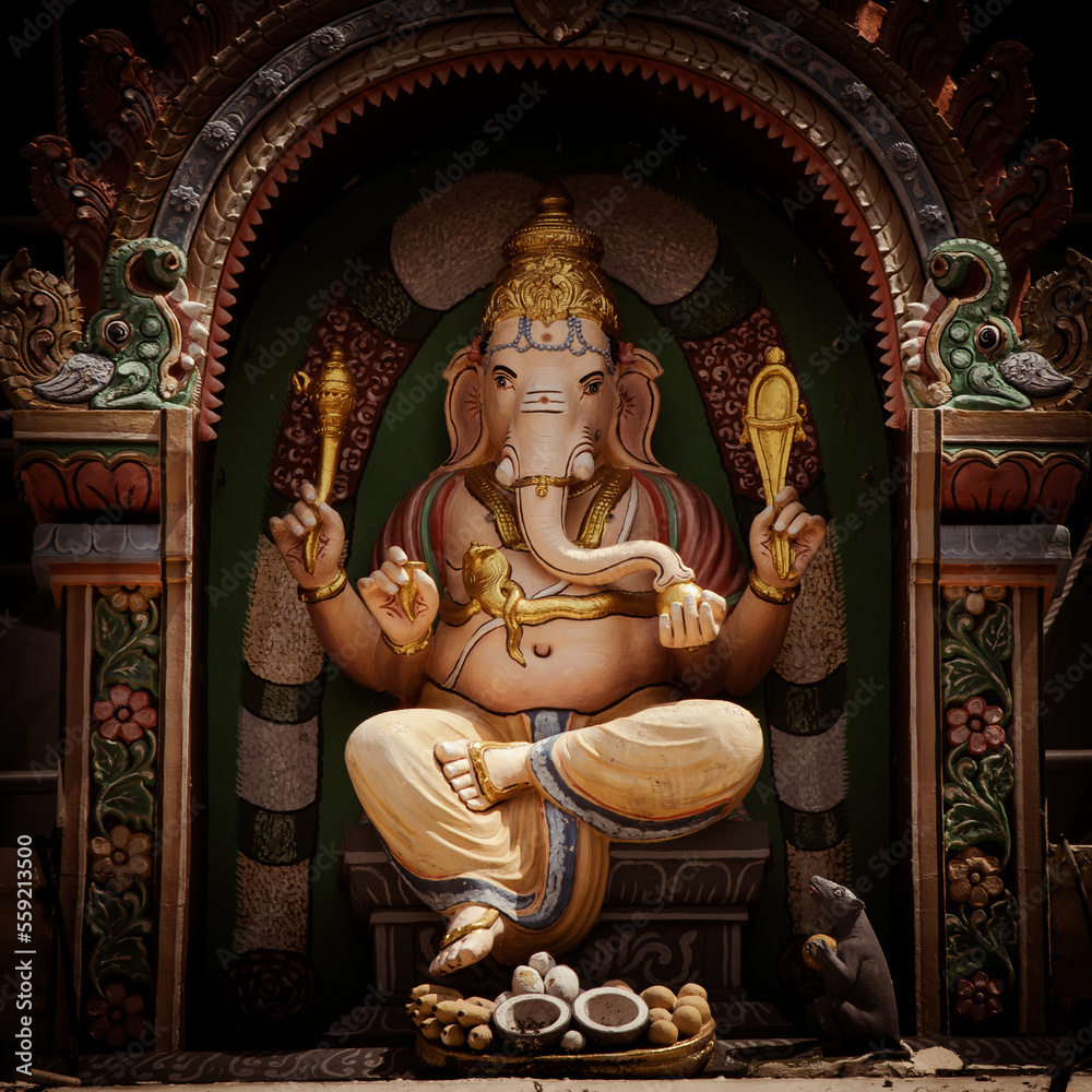 Fototapeta premium Singapore, Singapore - 01 July 2022: Vivid and colorful statue of the Hindu god, Ganesha, in the Sri Mariamman Temple, Singapore.