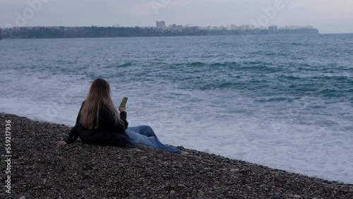 Antalya, Turkey - December 09 2022: Woman and waves