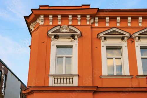 Corner of the house of classical European architecture of the old cozy tourist city. Background with selective focus