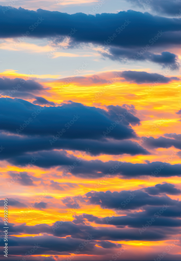 Sky scene at sunset with cloudy and golden sunshine