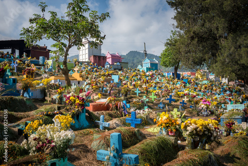 Toumbs and colored cross in Chichicastenango graveyard photo