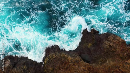 The raging ocean breaks the waves on the rocks. Beautiful 4K video for relaxation