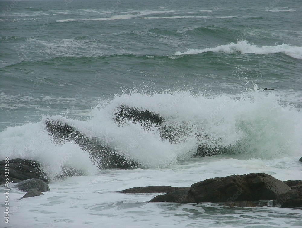 waves crashing over rocks