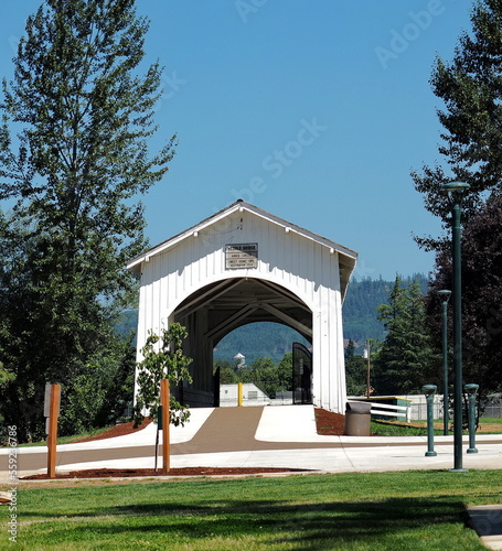 Walking Paths through the open-sided Weddle Covered Bridge that originally spanned Thomas Creek and has been relocated to cross Ames Creek Sankey Park in Sweet Home, Oregon.