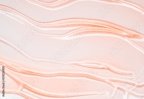 Gel serum pink texture cosmetics background, skincare hyaluronic acid or lubricant on white background.