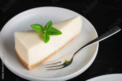 Cheesecake on a black wooden table