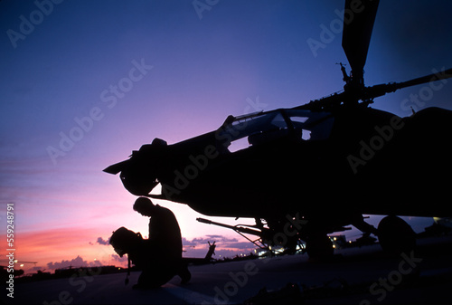 Apache Pilot say his prayers prior to mission. photo
