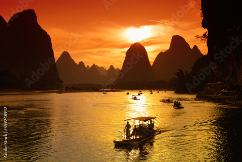 traditional boats to transport tourists along the Li River near Guillin photo