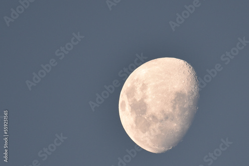 Moon in a light blue sky