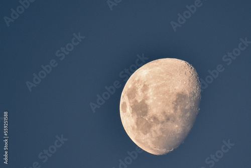 Moon in a light blue sky