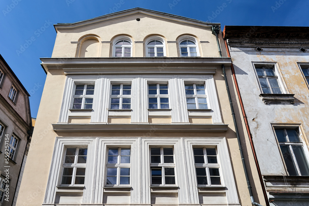 facade of a historic tenement house in the city of Poznan