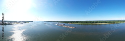 view of the river of 3 boats on the water going somewhere  