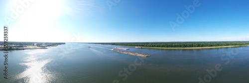 view of the river of 3 boats on the water going somewhere 