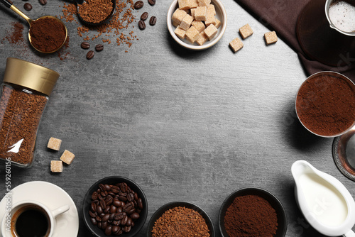 Flat lay composition with beans, instant and ground coffee on grey table. Space for text