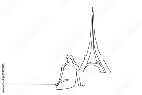woman female tourist taking a photo in front of the eiffel tower france