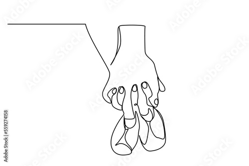 married couple pregnant hands holding baby shoes