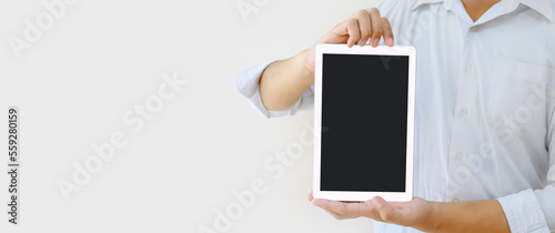 Hand holding blank screen phone or smartphone or tablet for template