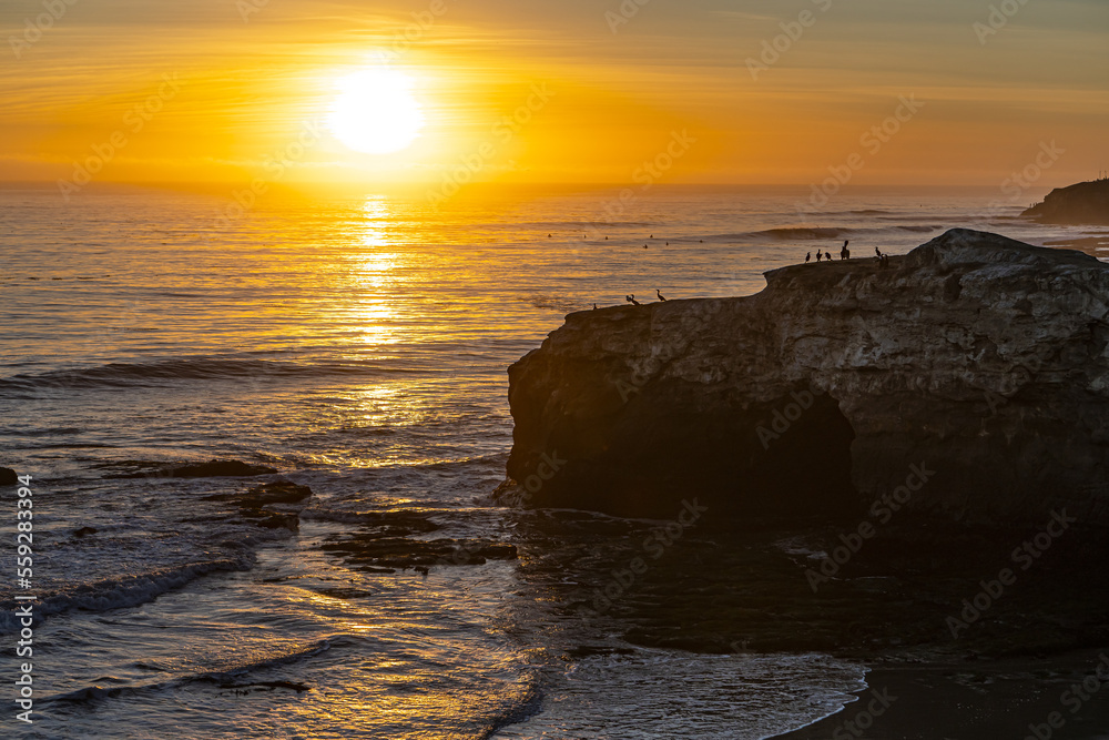 Beautiful sunset over the Pacific Ocean in Natural Bridges State Beach, Santa Cruz.