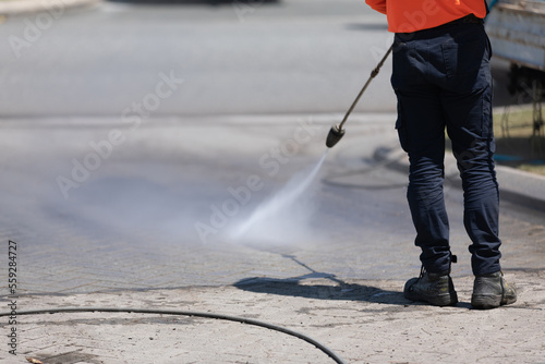 worker spraying water