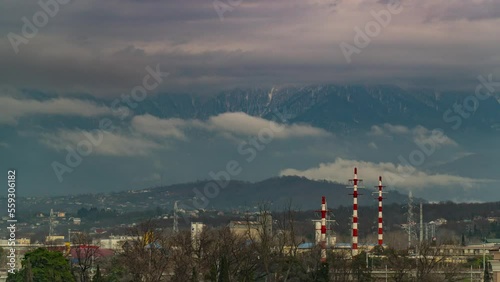 Time-lapse of overcast sky against the background of mountains, clouds fly quickly