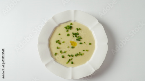 Vichyssoise, classic French chilled cream soup - potato leek, and onion topped with chopped chives