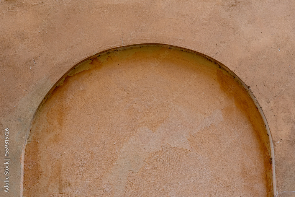 Orange old niche in the wall of som ancient building. Orange old niche in the wall of som ancient building.