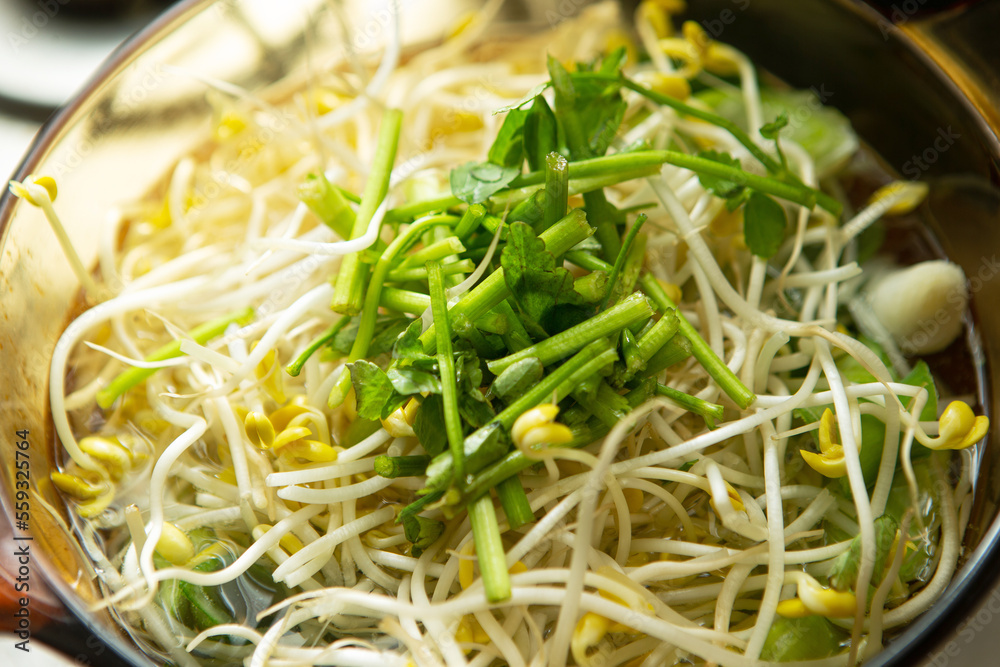 Clear clam soup boiling with vegetables in a pot Clear clam soup boiling with vegetables in a pot