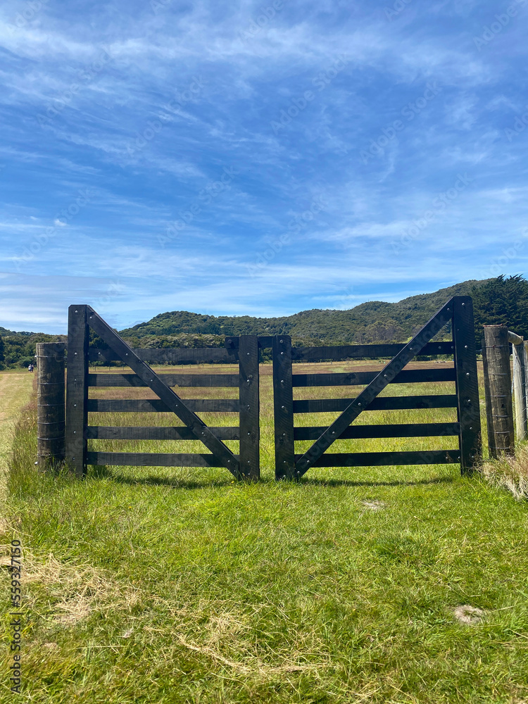 A wooden gate on a farm in New Zealand A wooden gate on a farm in New Zealand