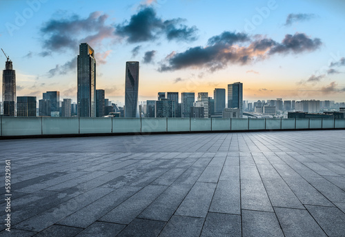 Empty square floor and modern city skyline with buildings at sunset in Ningbo, Zhejiang Province, China. © ABCDstock