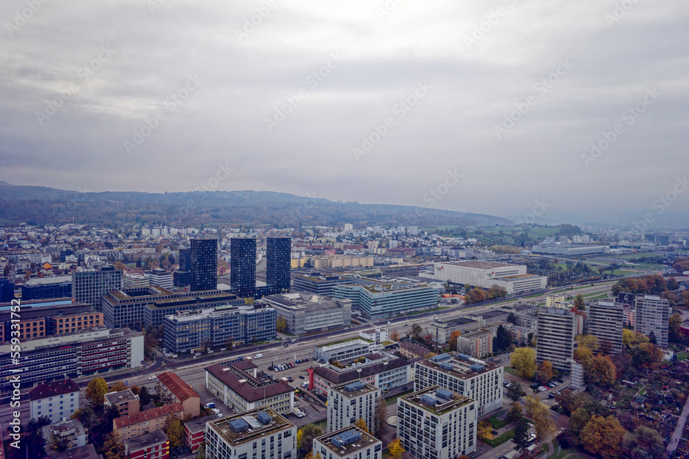 Fototapeta premium Aerial view of City of Zürich with skyline and panoramic view on a gray and cloudy late afternoon. Photo taken November 12th, 2022, Zurich, Switzerland.