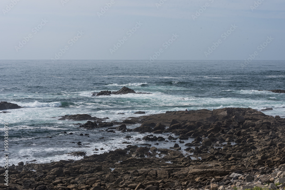 waves breaking on the rocks