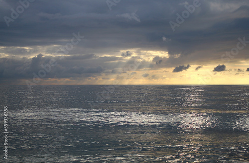 storm clouds in the blue sky over the sea