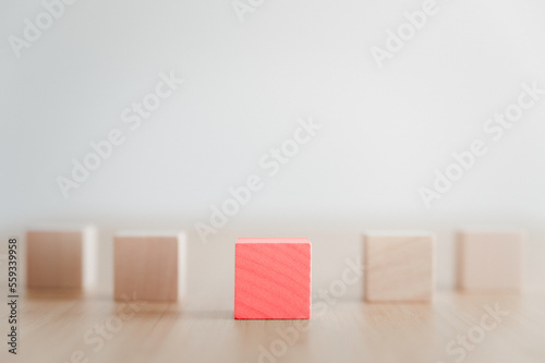 Red wood block leader concept on the table, leader and success concept.