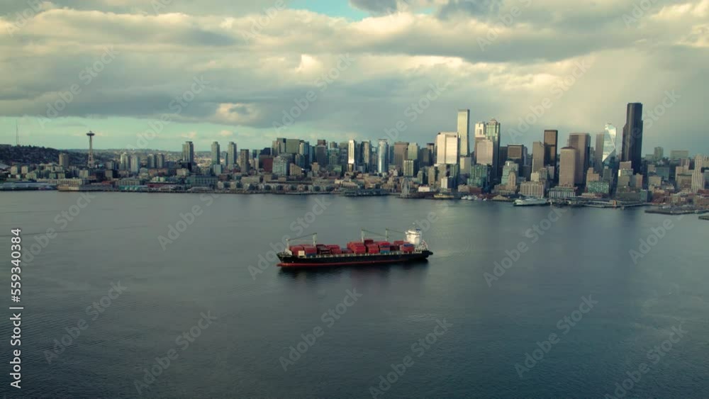 Aerial View of Container Ship in Seattle Harbor with Skyline Buildings Aerial View of Container Ship in Seattle Harbor with Skyline Buildings
