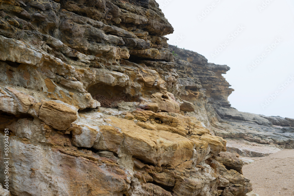 Rock formation isolated on white background. Rock formations in smmer, Nazare, Portugal. Rock background texture. 