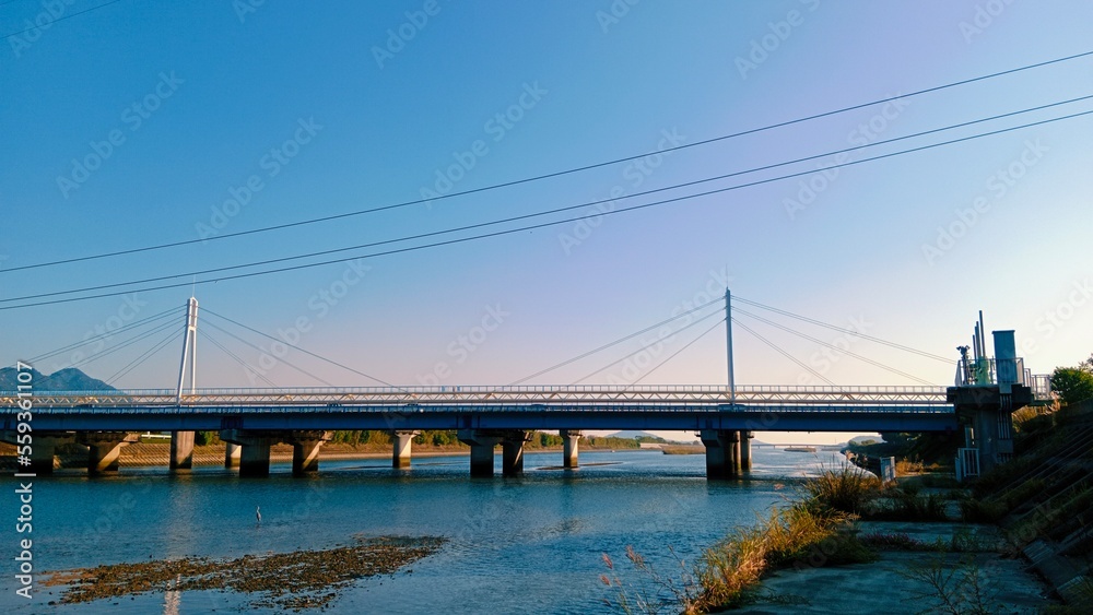 Fototapeta premium bridge over river with the blue sky
