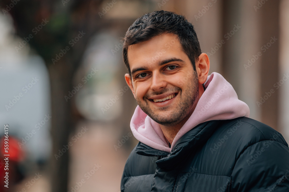portrait casual young man in the street smiling portrait casual young man in the street smiling