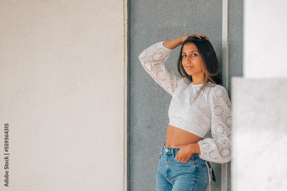 latin american girl leaning on the wall latin american girl leaning on the wall